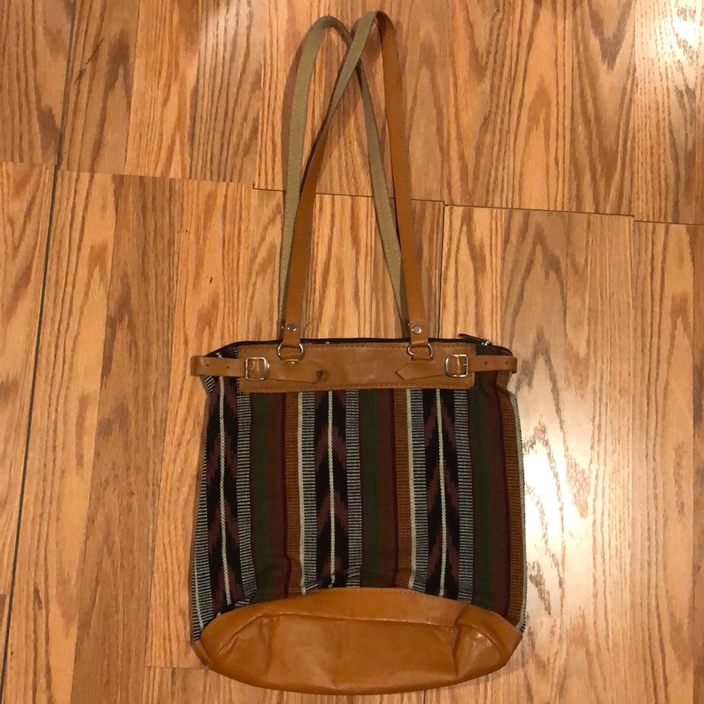 Leather and brown huipil embroidered shoulder bag.
